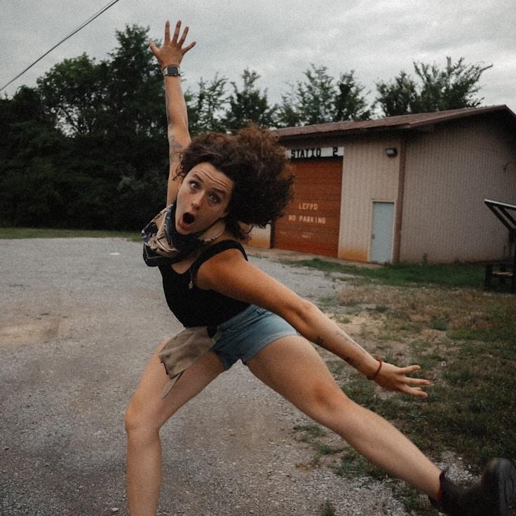 Kaveri Mehta, Lead Design Curator at VillagePulseWay, reviewing corporate floral arrangements